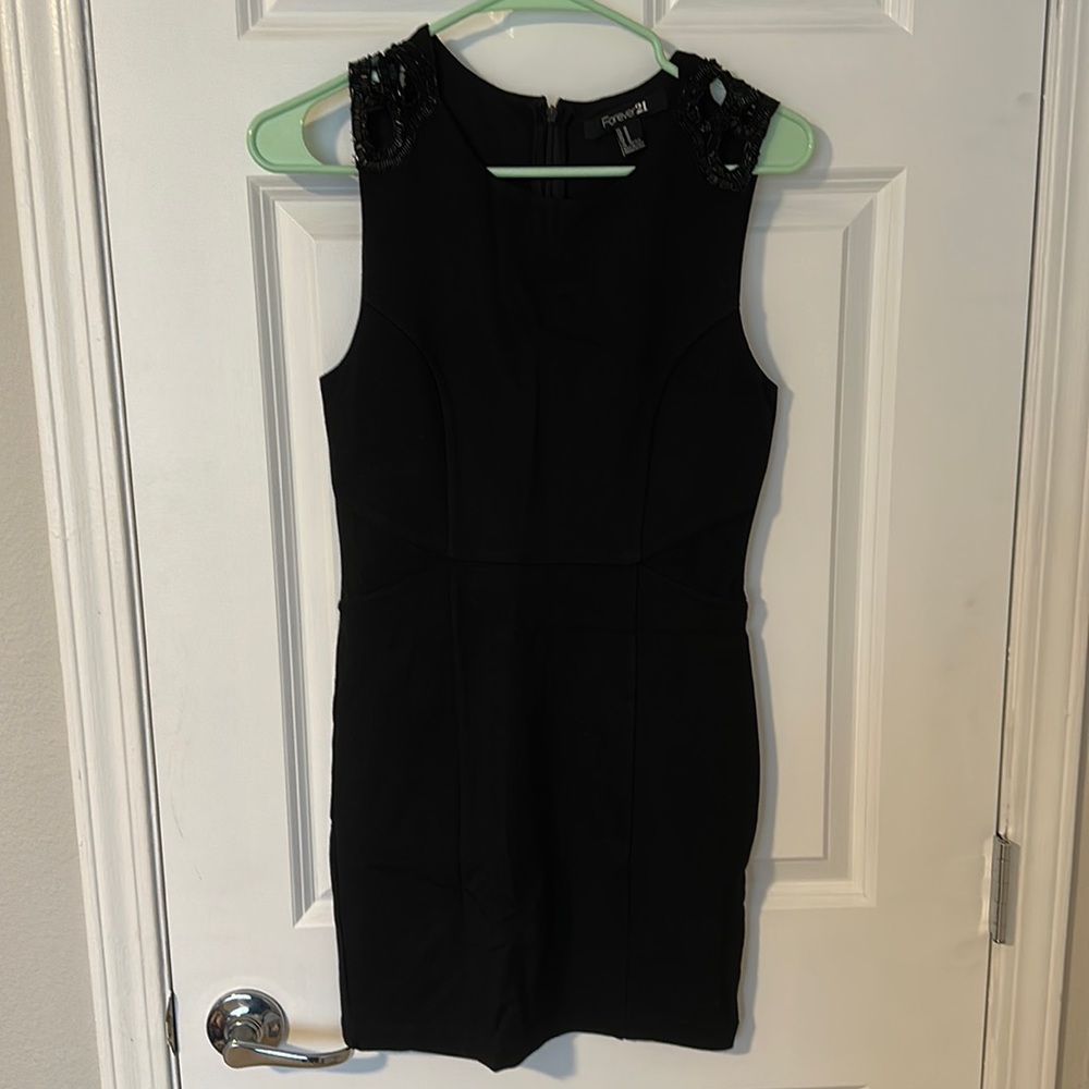Black bodycon dress from Forever 21. Size medium. Never been worn.